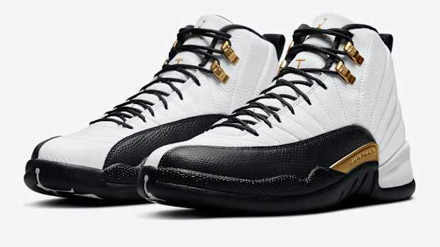 Side view of white and black Air Jordan sneakers.